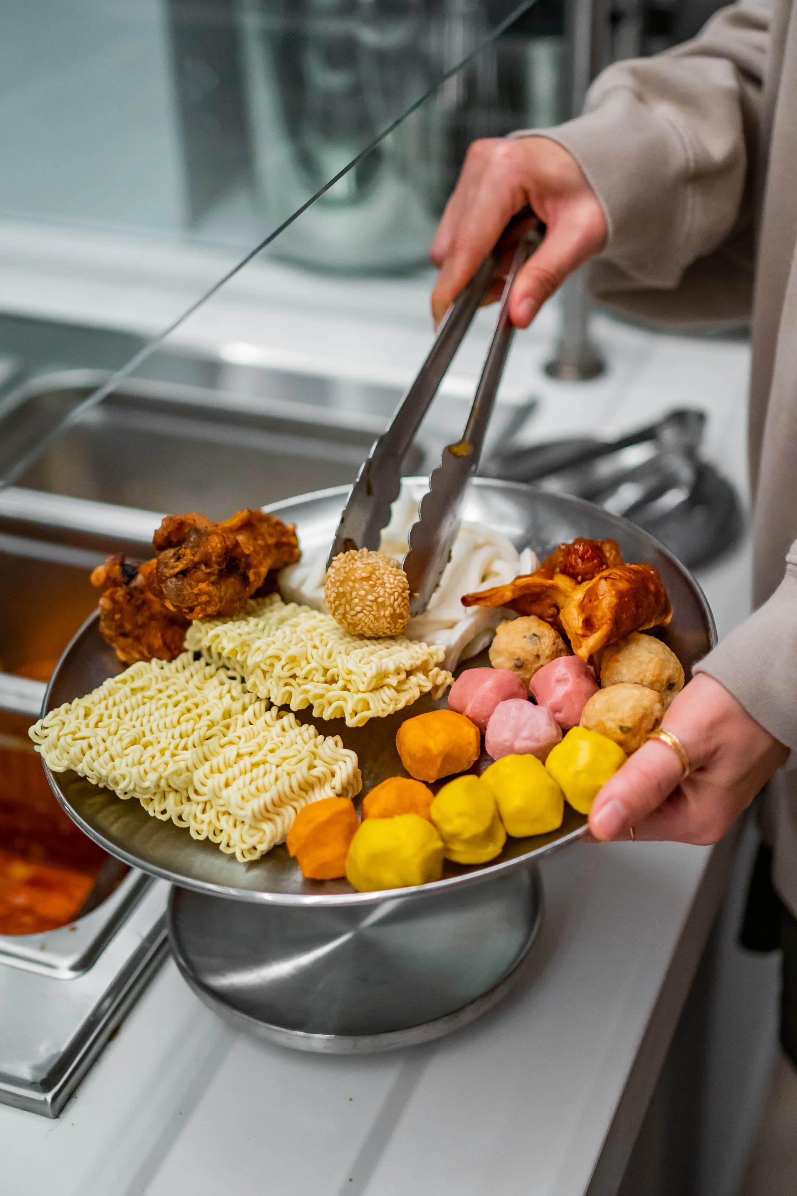 Hot bar sides — noodles, fish balls, fried items